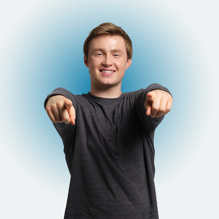 Cropped photo of LMU political science major Aidan Pidgeon smiling and pointing at the camera on a white background.
